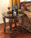 Norcastle - Dark Brown - Round End Table Cleveland Home Outlet (OH) - Furniture Store in Middleburg Heights Serving Cleveland, Strongsville, and Online